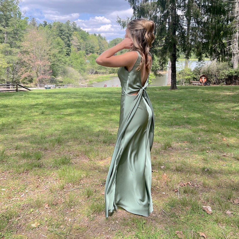 Sage green bridesmaid dress, satin with slit and low tie back.